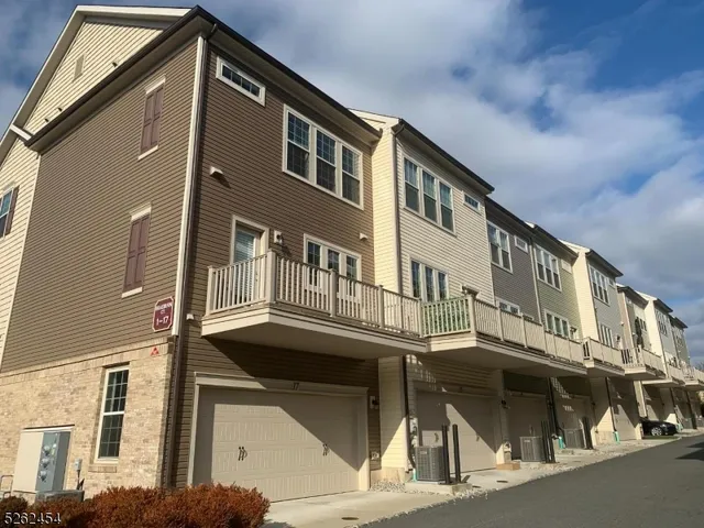a front view of a building with a street