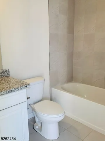 a bathroom with a toilet a sink and bathtub