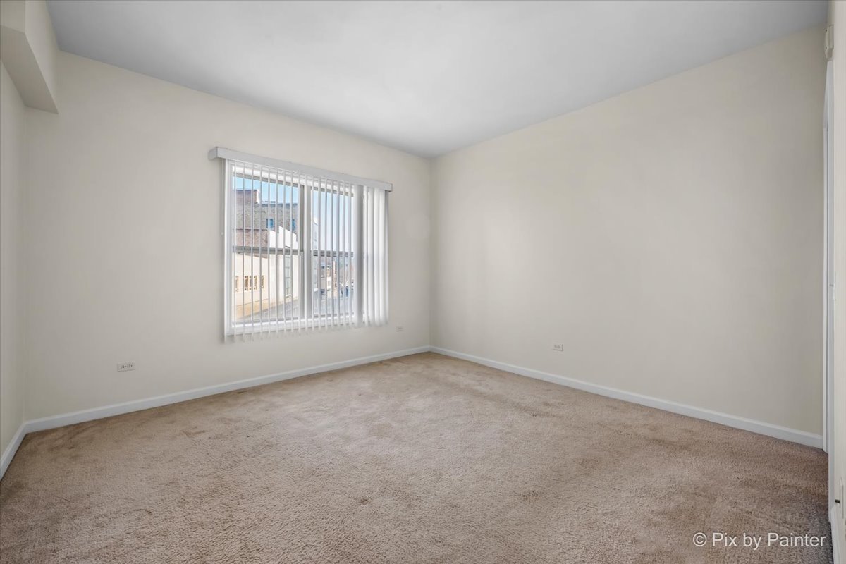 50 South Grove Avenue, Unit 301 Elgin, IL 60120 - Photo 11 of 25 an empty room with windows