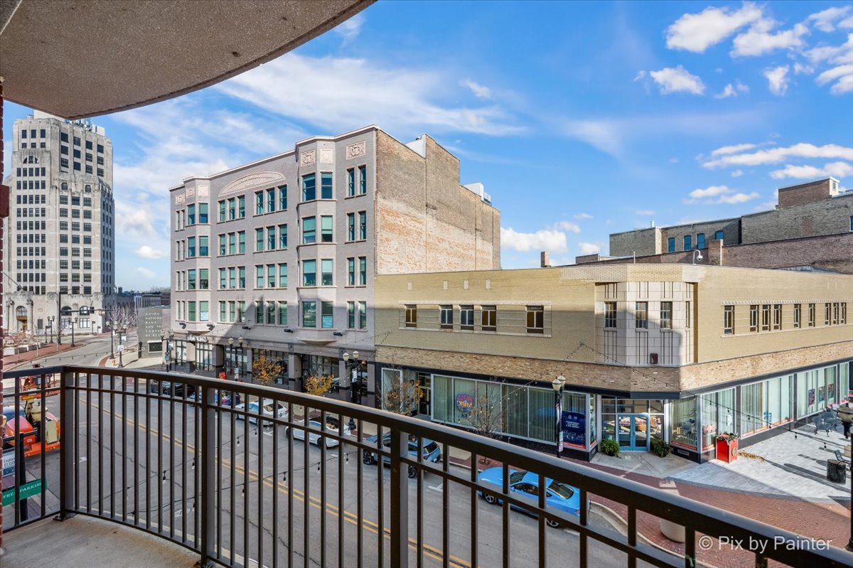 50 South Grove Avenue, Unit 301 Elgin, IL 60120 - Photo 22 of 25 a view of a building from a balcony