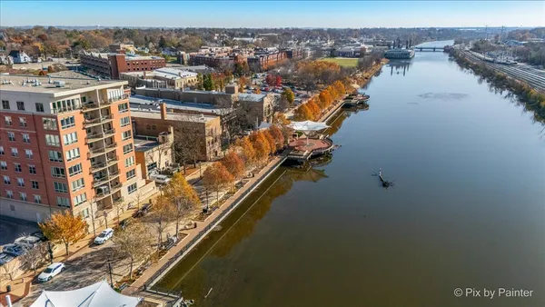 an aerial view of residential building and lake