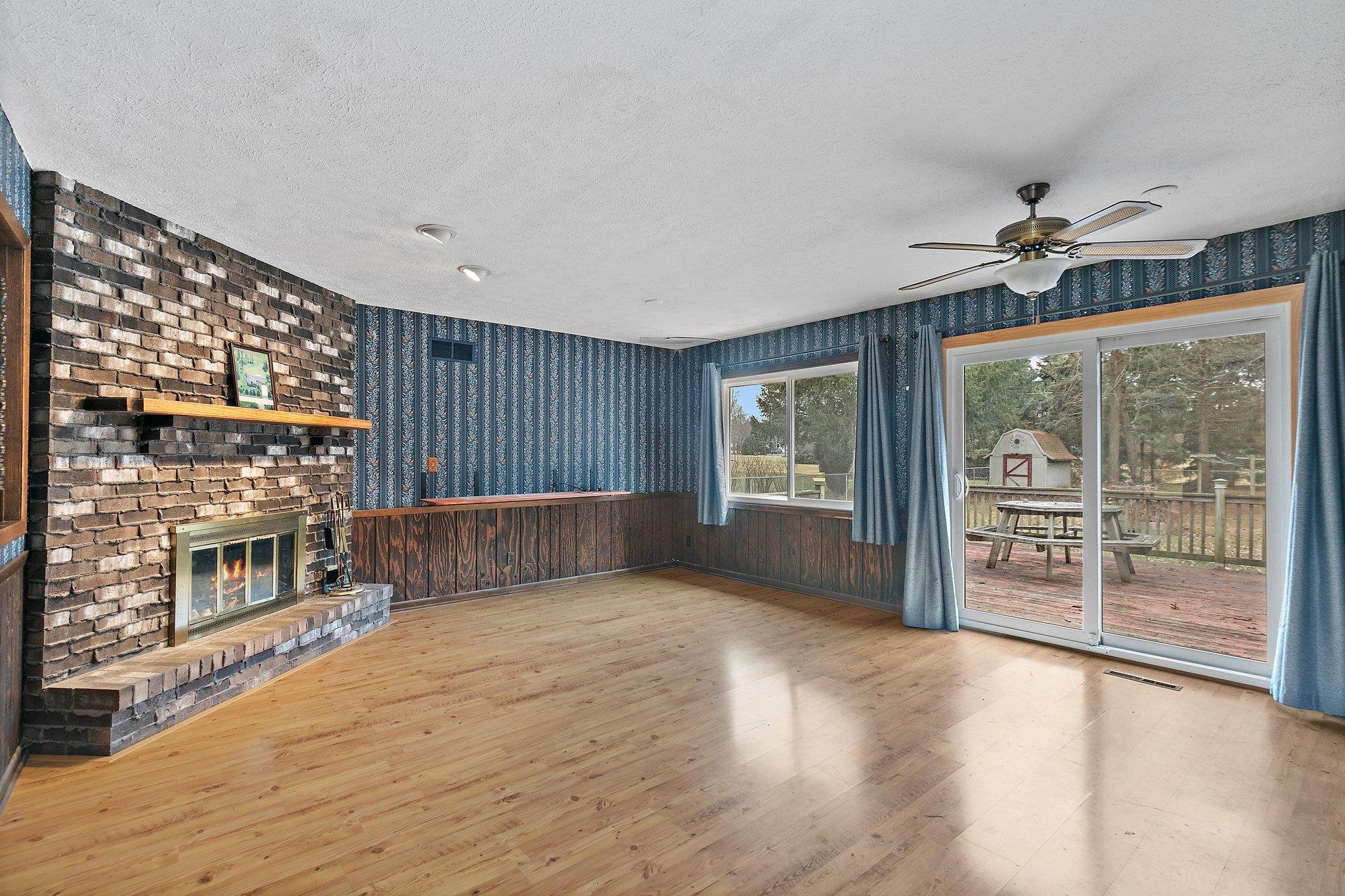 2783 Karr Road Belvidere, IL 61008 - Photo 4 of 17 a view of an empty room with a window and wooden floor