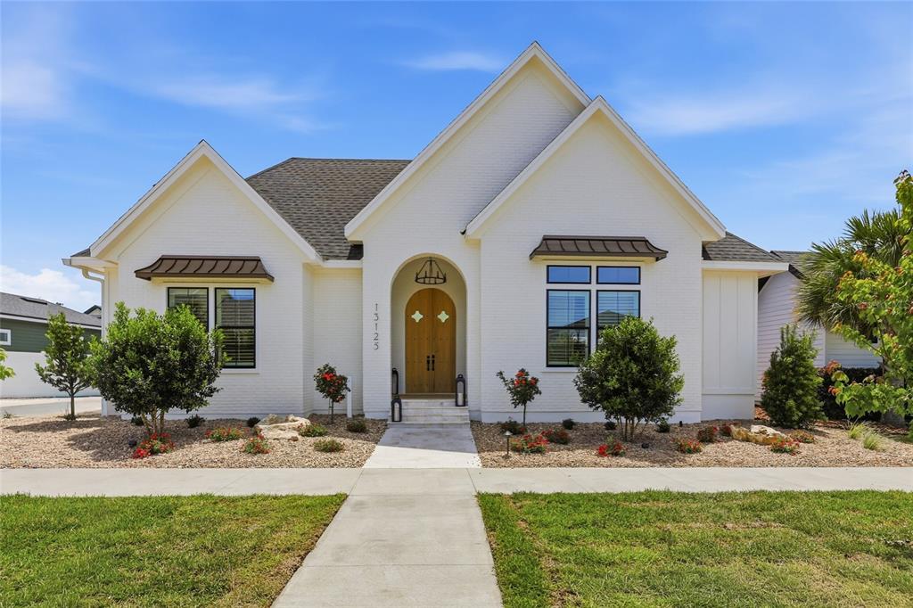 a front view of house with yard outdoor seating and entertaining space