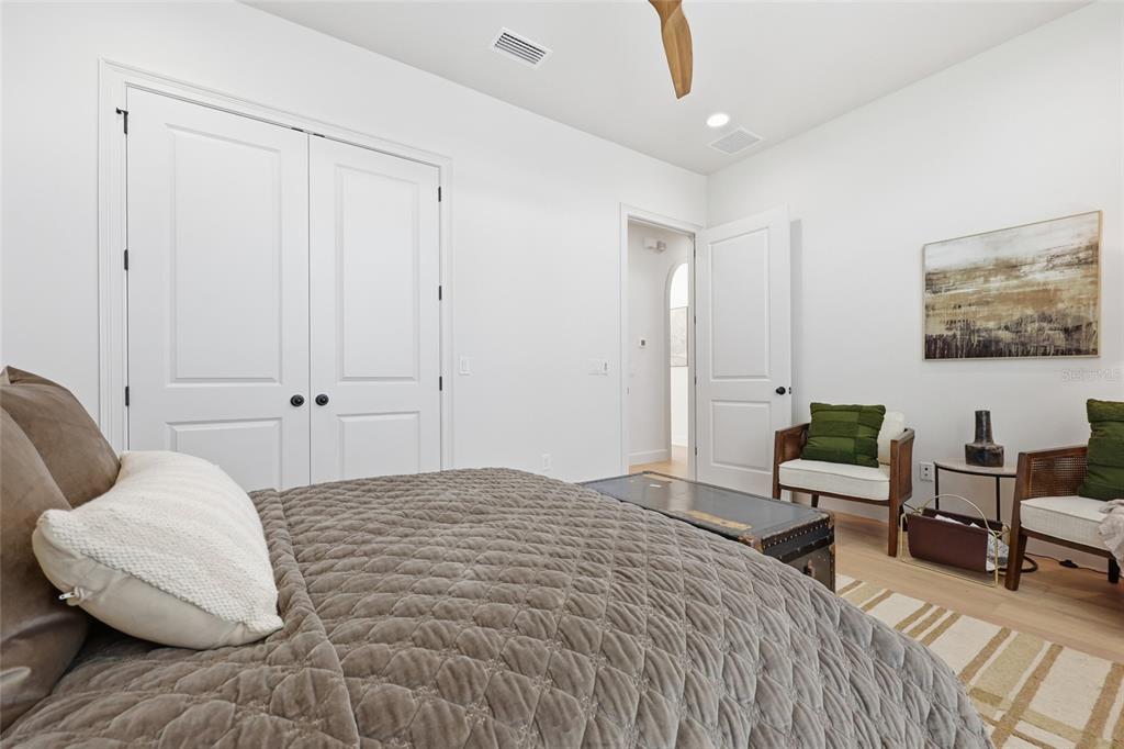 13125 Southwest 9th Road Newberry, FL 32669 - Photo 15 of 53 a bedroom with a bed and a chair