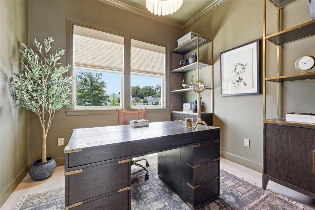 13125 Southwest 9th Road Newberry, FL 32669 - Photo 21 of 53 a view of a workspace with furniture and a potted plant