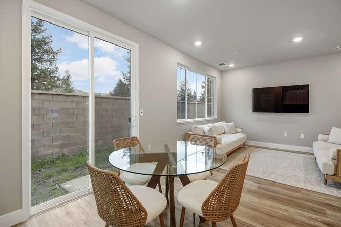 1480 Westwind Way Rocklin, CA 95765 - Photo 13 of 27 a living room with furniture a flat screen tv and a floor to ceiling window