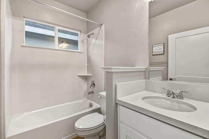 1480 Westwind Way Rocklin, CA 95765 - Photo 17 of 27 a bathroom with a sink toilet and shower
