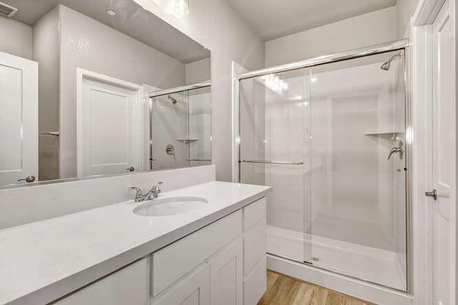 1480 Westwind Way Rocklin, CA 95765 - Photo 21 of 27 a bathroom with a shower sink and mirror