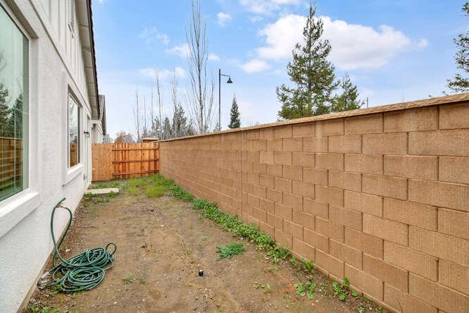 1480 Westwind Way Rocklin, CA 95765 - Photo 26 of 27 a backyard of a house with lots of green space
