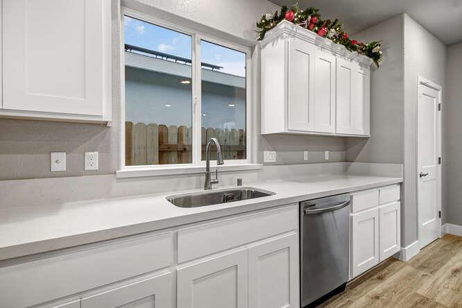 1480 Westwind Way Rocklin, CA 95765 - Photo 6 of 27 a kitchen with a sink and cabinets