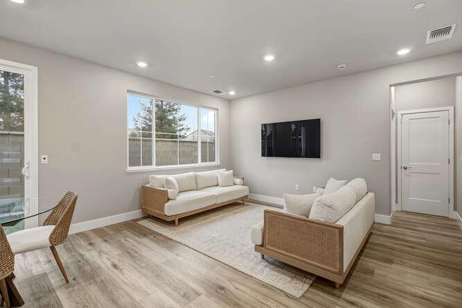 1480 Westwind Way Rocklin, CA 95765 - Photo 7 of 27 a living room with furniture and a flat screen tv