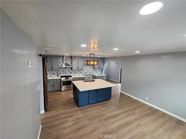 a view of kitchen and kitchen with windows