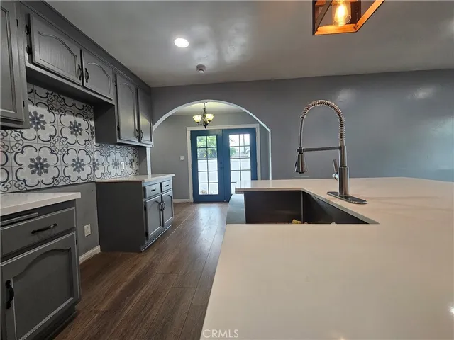 a kitchen with stainless steel appliances a sink and a stove