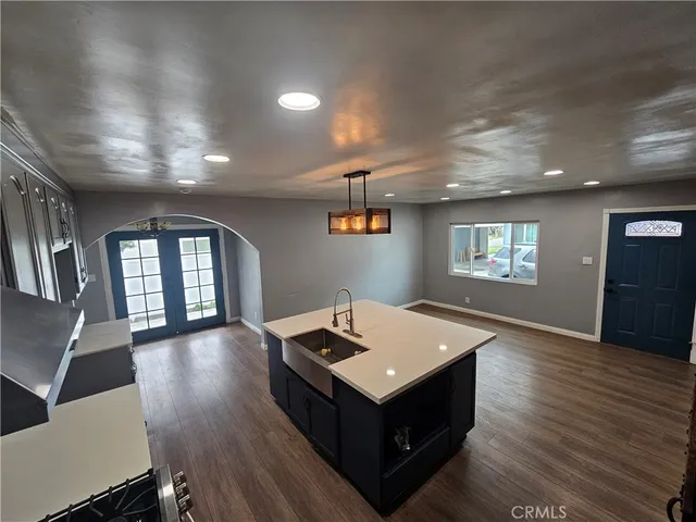 a living room with hard wood flooring and a couch