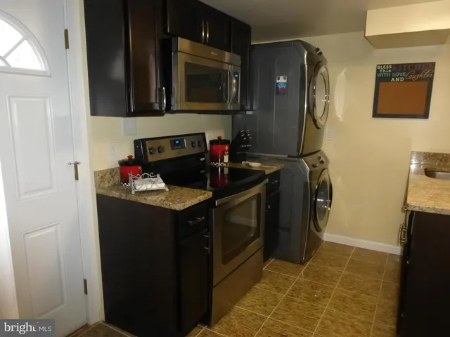 a kitchen with a sink stove and refrigerator