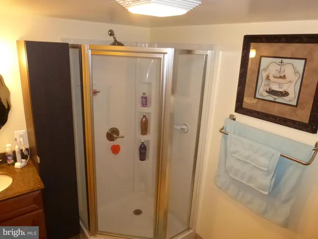 a view of a yard and brick wall