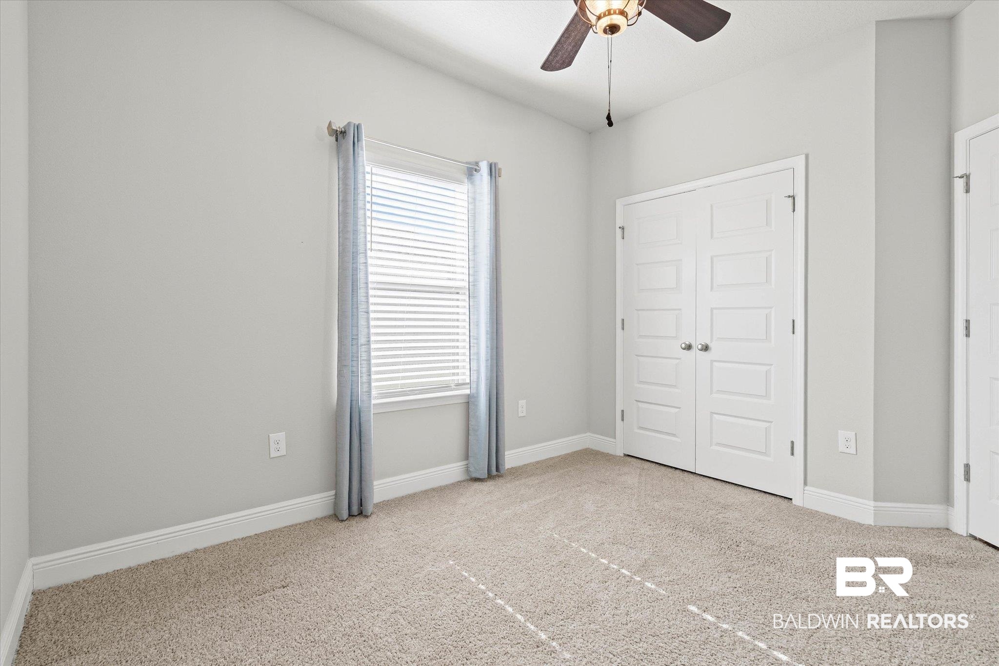10207 Dunleith Loop Daphne, AL 36526 - Photo 13 of 23 Unfurnished bedroom with light carpet and a ceiling fan