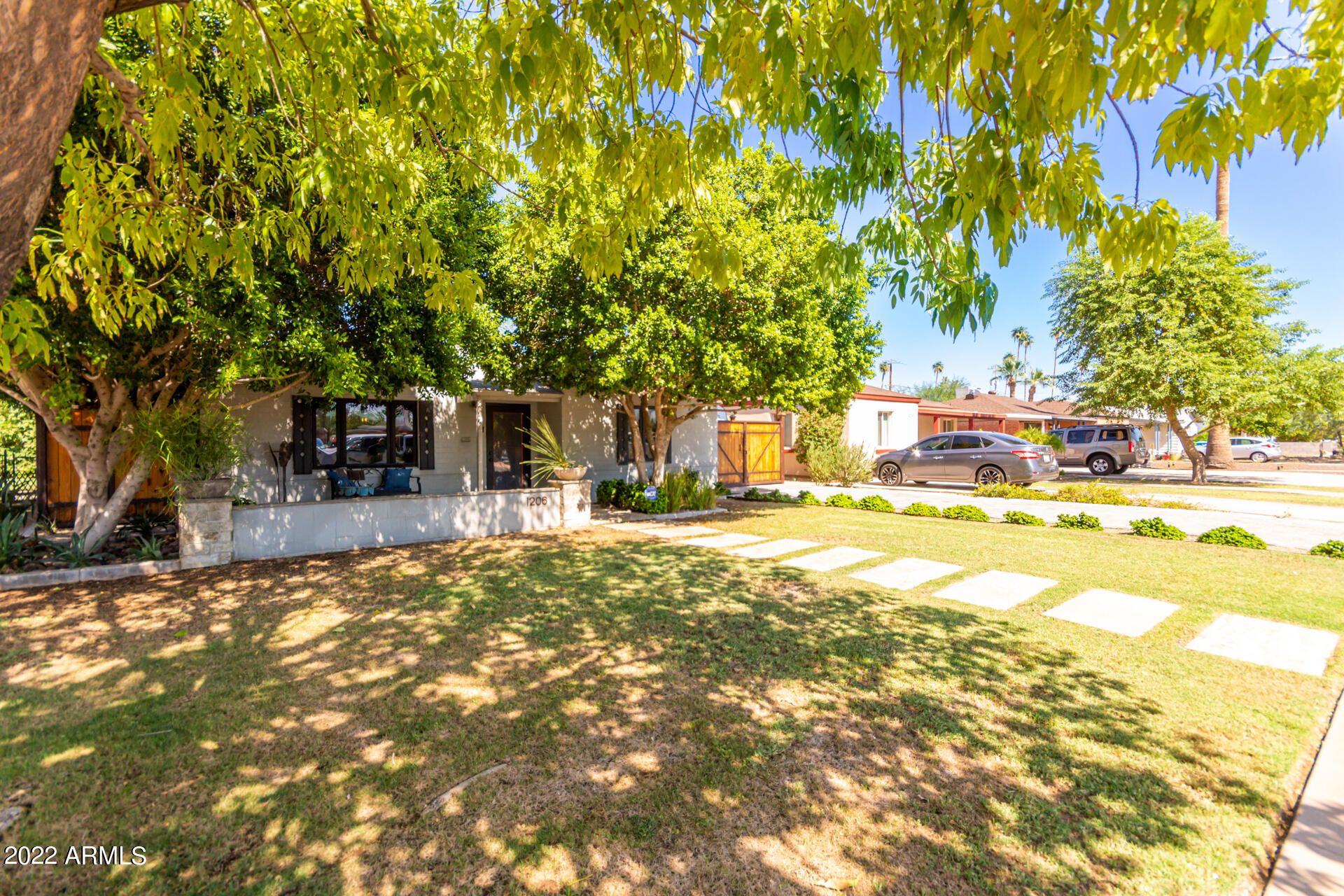 1206 East Almeria Road Phoenix, AZ 85006 - Photo 2 of 28 a view of a house with large trees