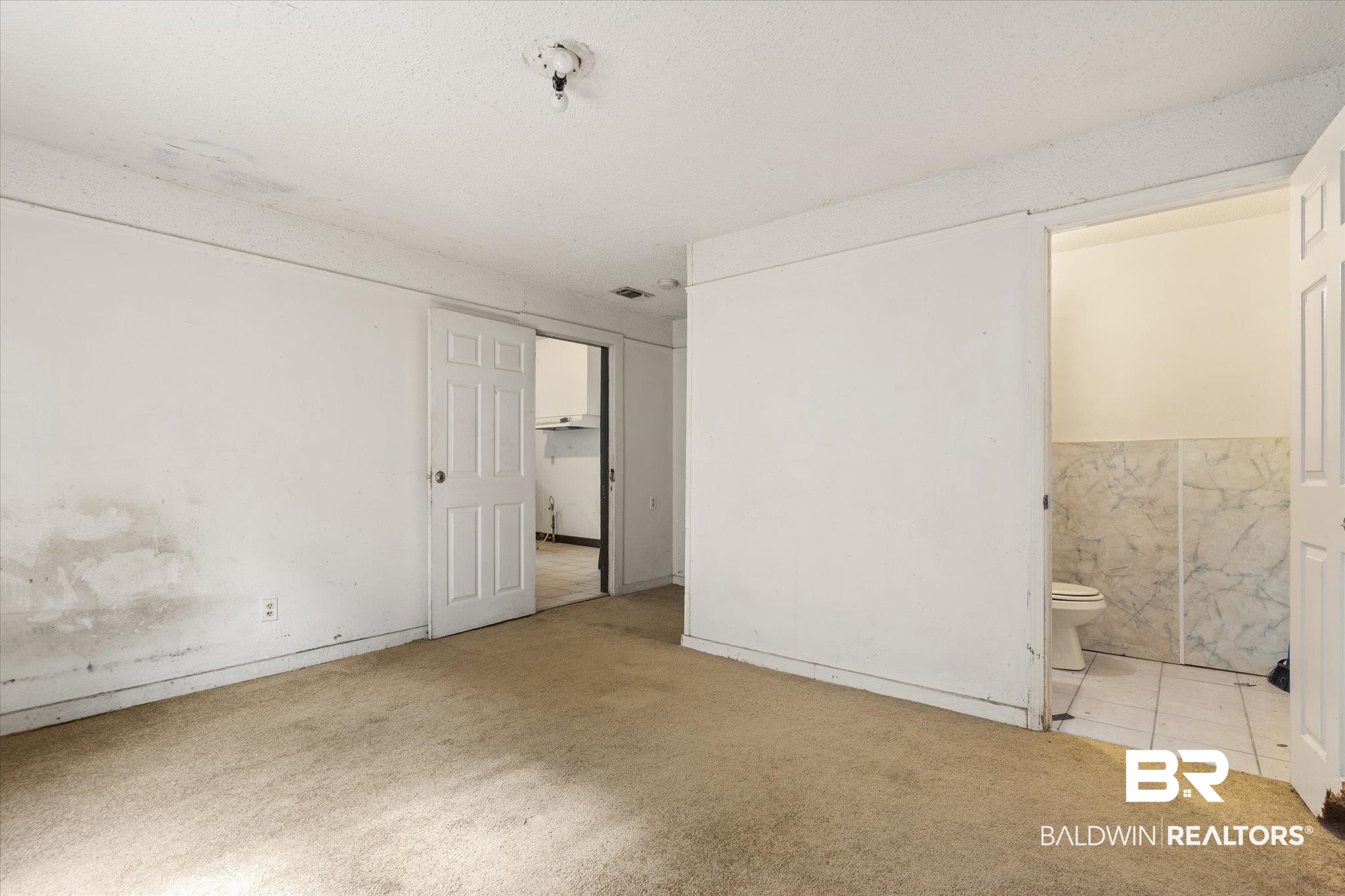 672 Burden Street Mobile, AL 36607 - Photo 11 of 20 Unfurnished bedroom with carpet and ensuite bath