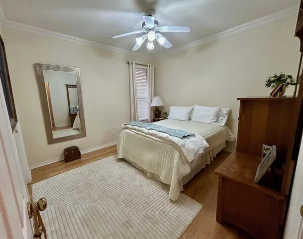 a bedroom with bed and a couch