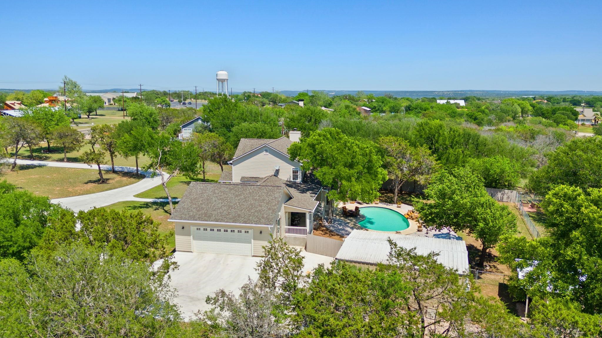 2409 Mormon Mill Road Marble Falls, TX 78654 - Photo 28 of 30 an aerial view of a house with garden space and street view