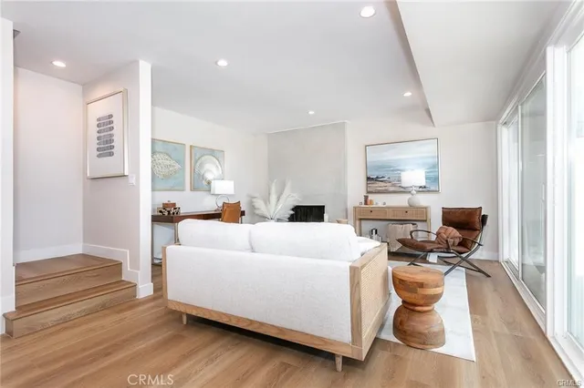 a view of a room with wooden floor and white cabinet