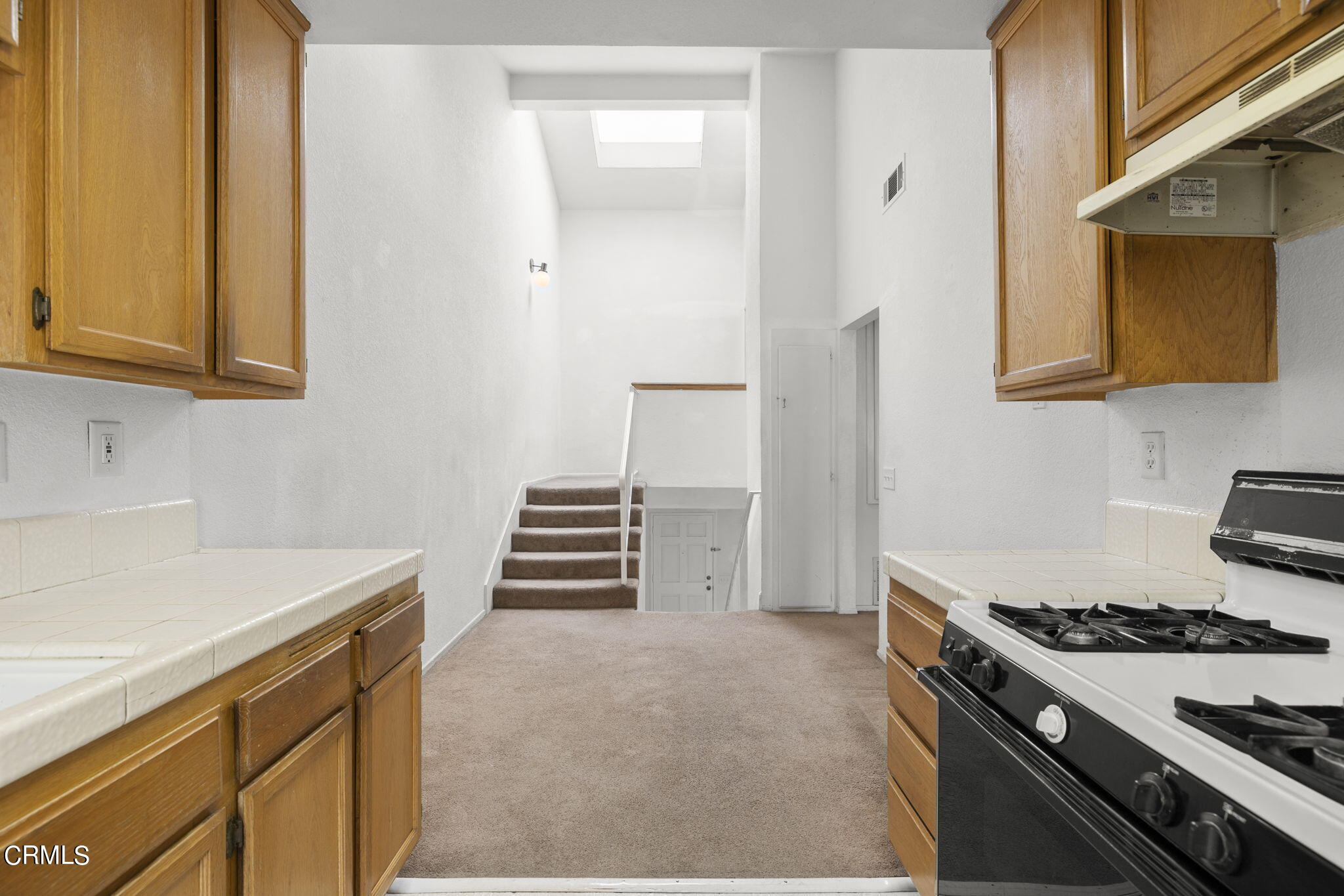 5182 Columbus Place Oxnard, CA 93033 - Photo 15 of 39 a kitchen with a stove and a sink