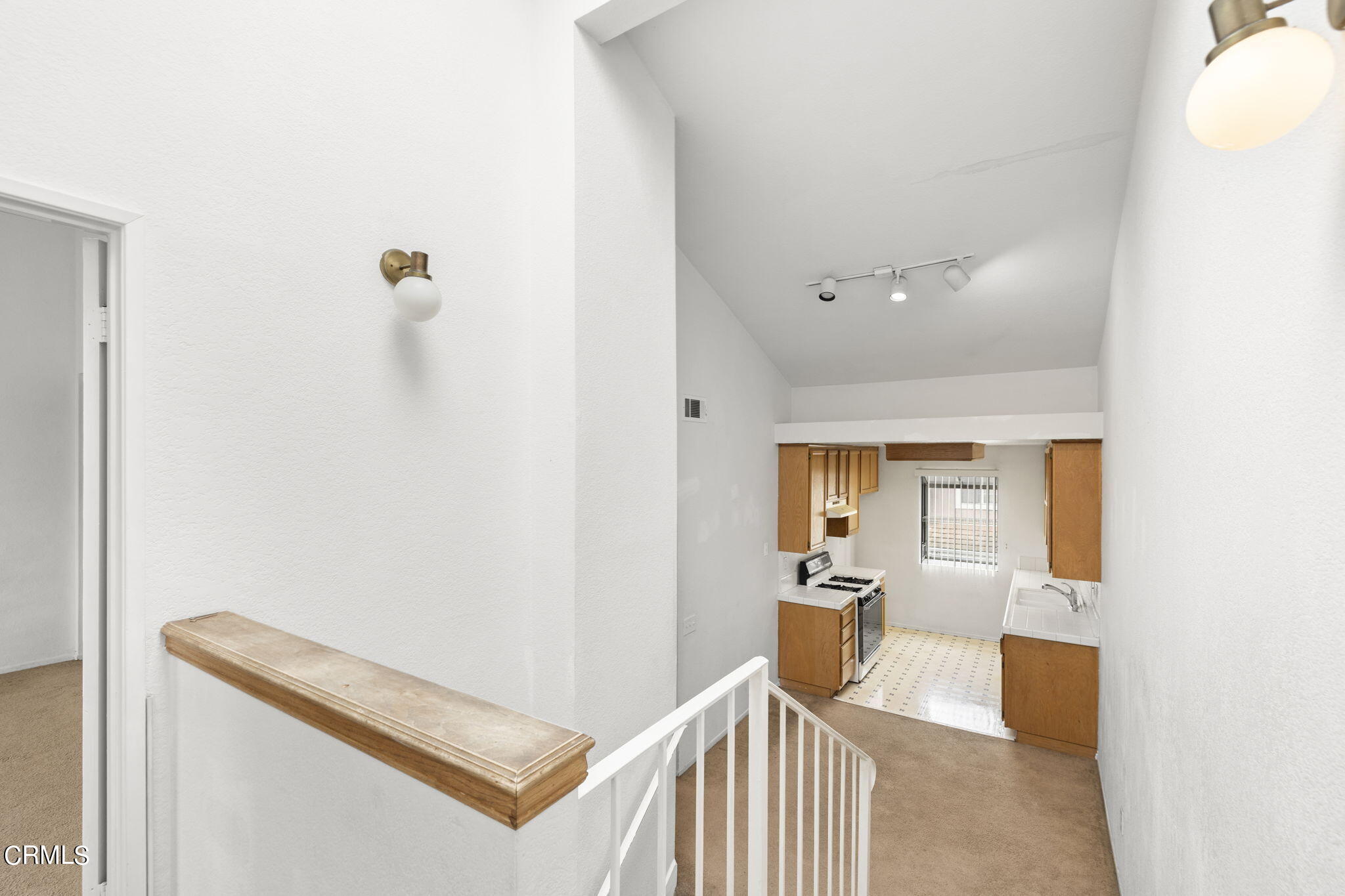 5182 Columbus Place Oxnard, CA 93033 - Photo 19 of 39 a view of a hallway to a livingroom with furniture