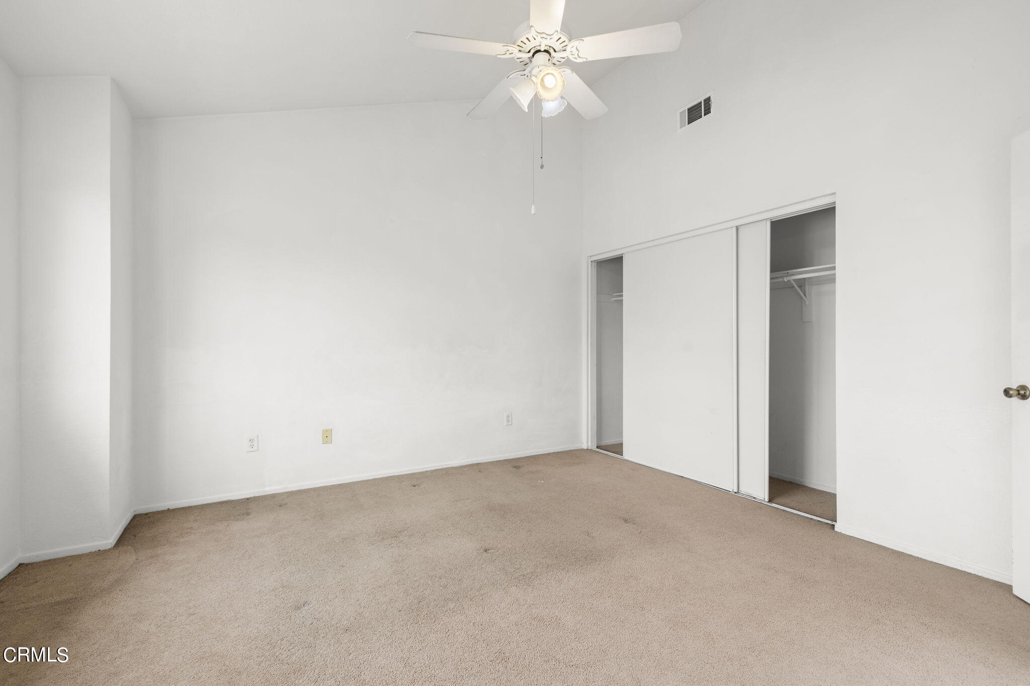 5182 Columbus Place Oxnard, CA 93033 - Photo 21 of 39 an empty room with a ceiling fan and a window