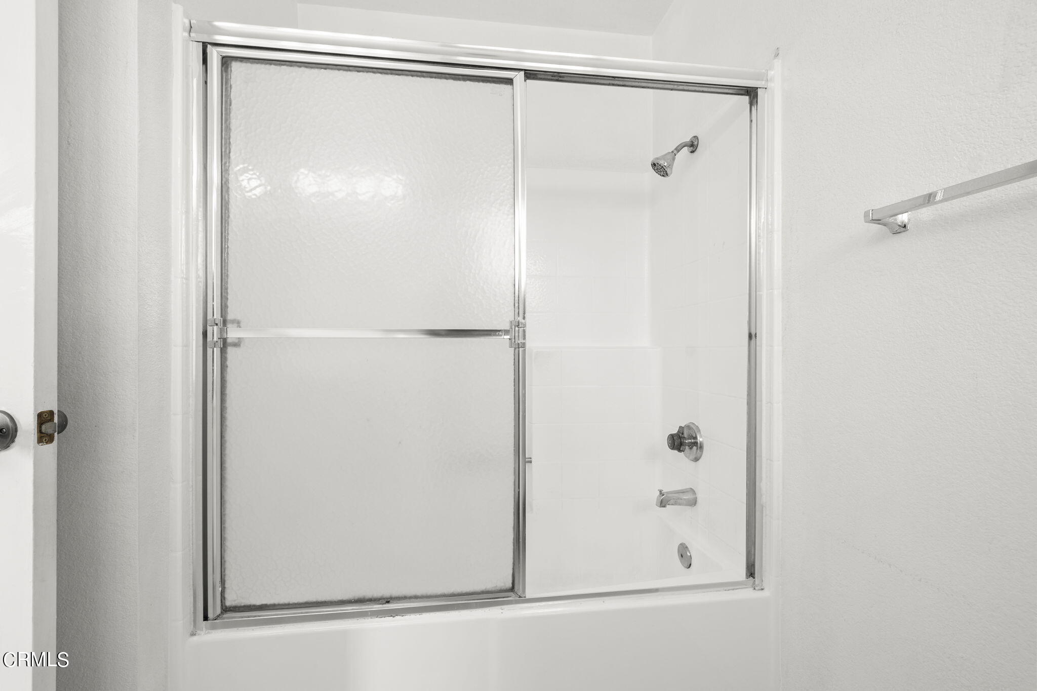 5182 Columbus Place Oxnard, CA 93033 - Photo 25 of 39 a bathroom with a glass shower door