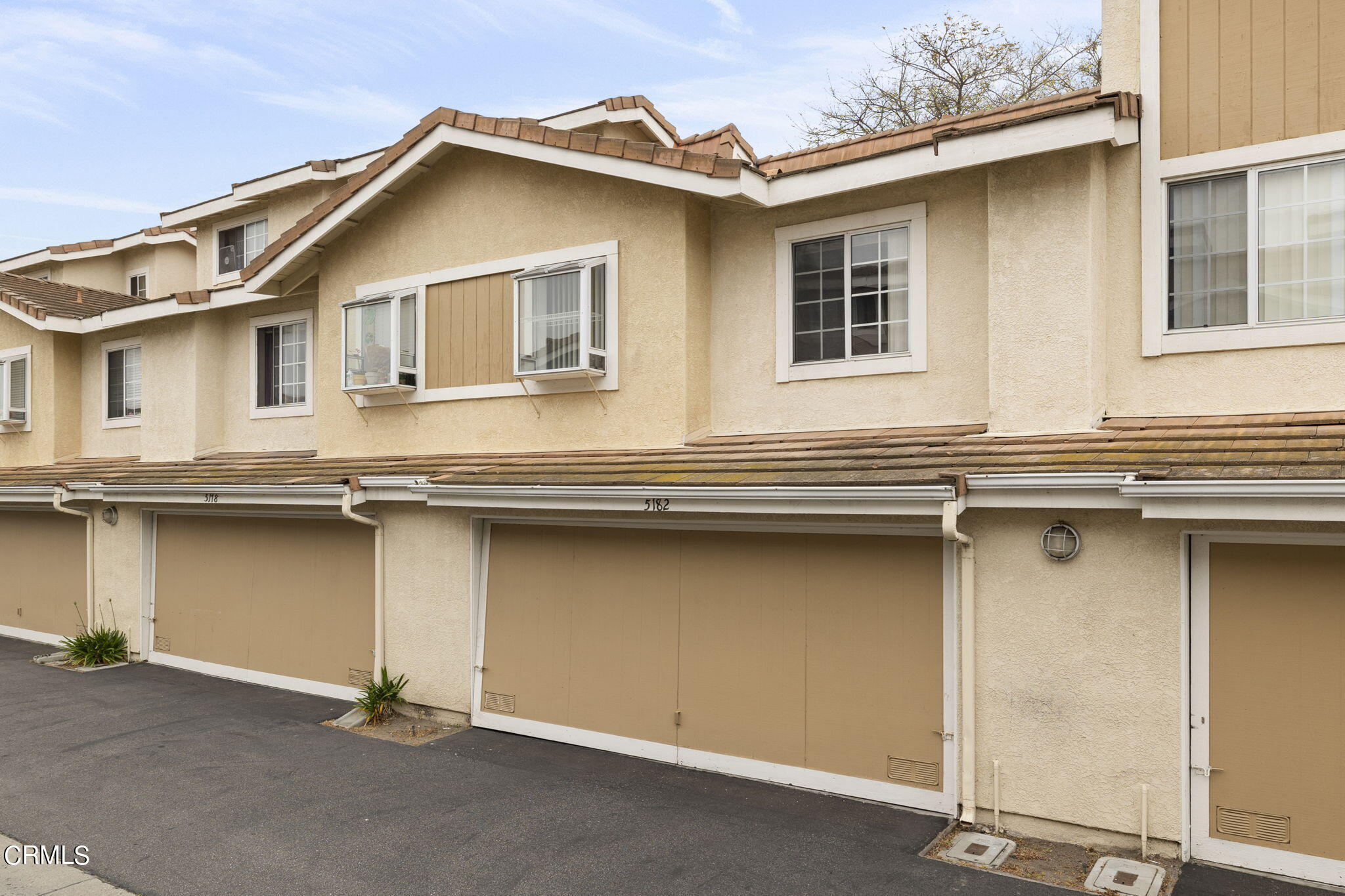 5182 Columbus Place Oxnard, CA 93033 - Photo 28 of 39 a front view of a house with garage