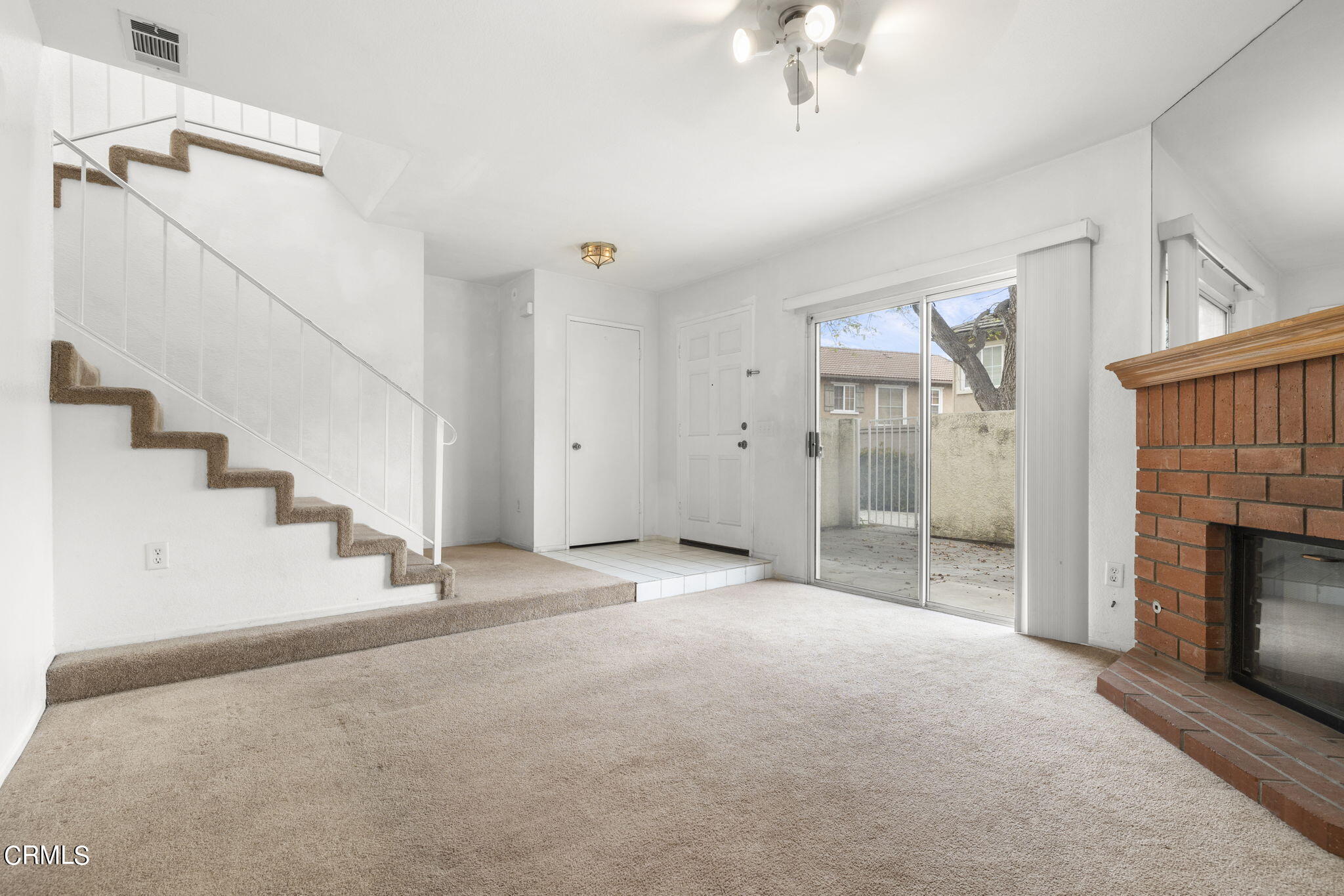 5182 Columbus Place Oxnard, CA 93033 - Photo 7 of 39 a view of a livingroom with an empty space and a fireplace