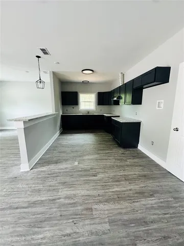 a view of a living room with a kitchen