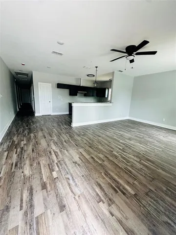 a view of a kitchen with a sink and a stove
