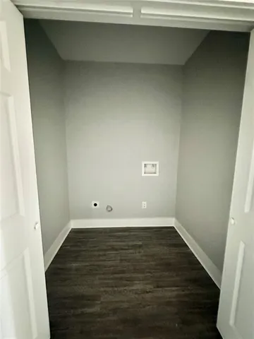 a view of a small space with wooden floor