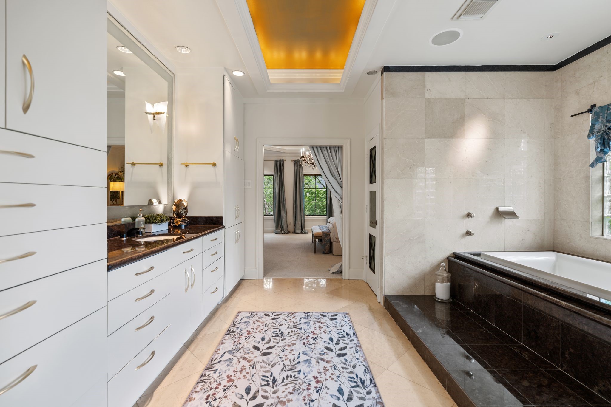 30 Hackberry Lane, Unit A Houston, TX 77027 - Photo 27 of 42 The coved ceiling also takes center stage in the primary bathroom.