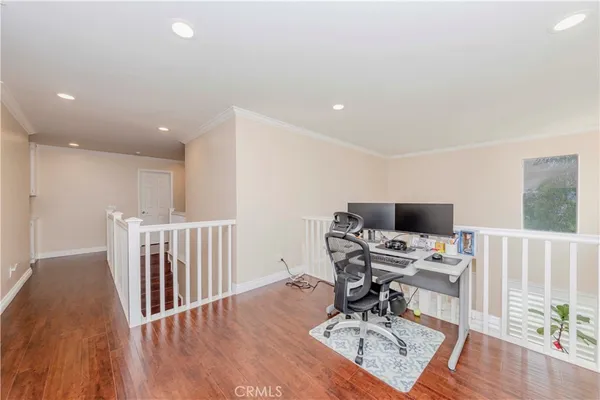 a workspace with furniture and wooden floor