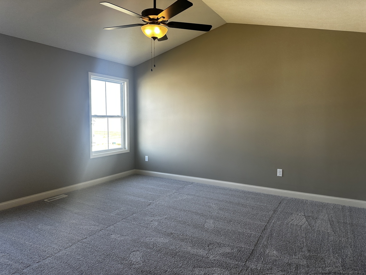 2 Roscoe Court Bloomington, IL 61705 - Photo 16 of 16 an empty room with a window and wooden floor