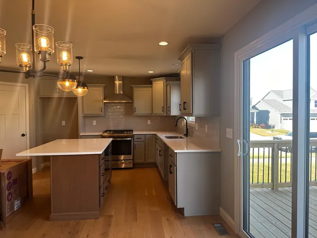 a kitchen with a sink a counter top space and appliances