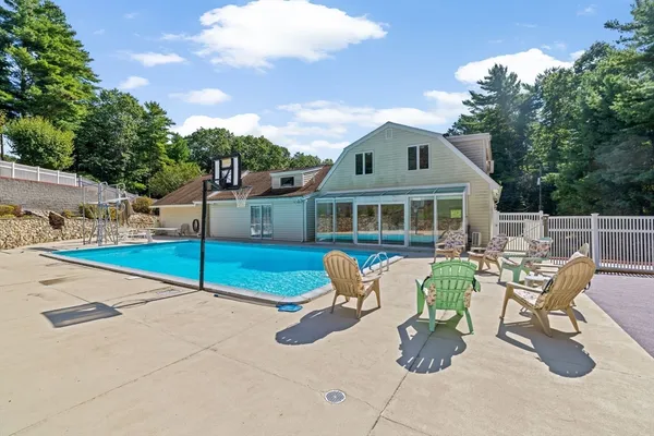 a view of a house with backyard porch and sitting area