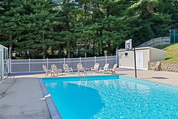 an aerial view of a house with swimming pool garden and patio