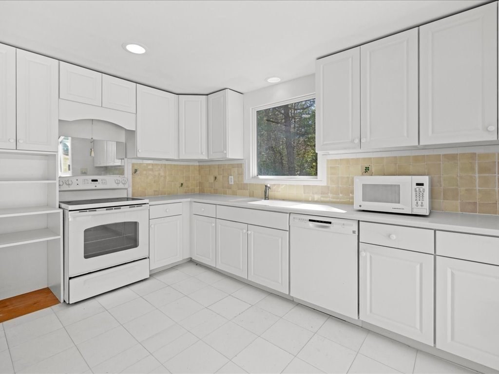18 James Road Duxbury, MA 02332 - Photo 22 of 34 a kitchen with white cabinets and white appliances