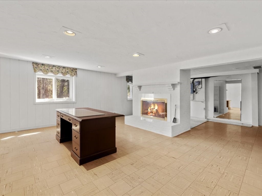 18 James Road Duxbury, MA 02332 - Photo 27 of 34 a living room with furniture and a fireplace