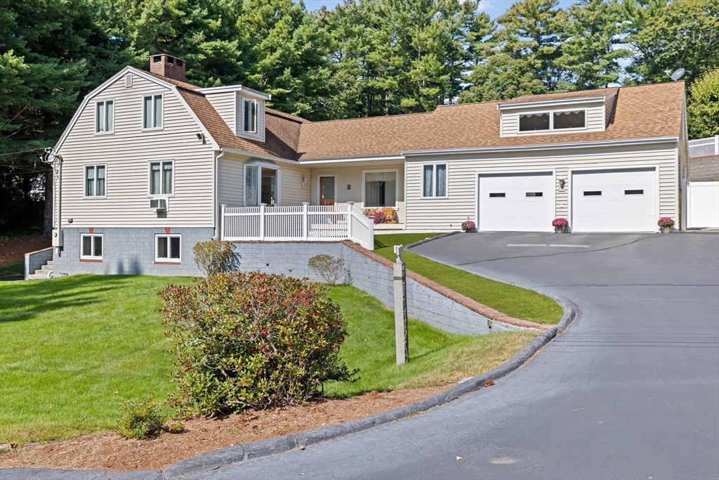 18 James Road Duxbury, MA 02332 - Photo 9 of 34 a front view of a house with garden