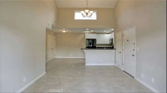a view of a kitchen with a sink and cabinets
