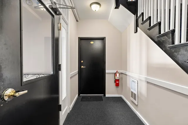 a view of a patio with a table and chairs
