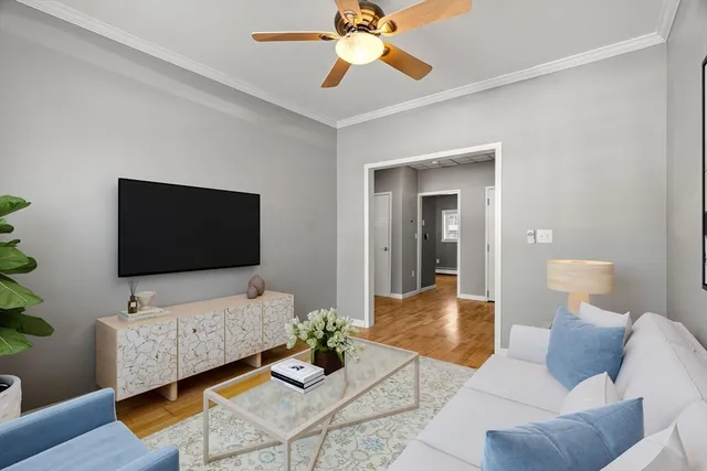 a living room with furniture and a flat screen tv