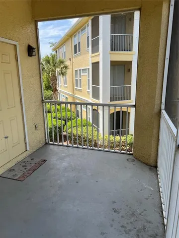 a view of a livingroom with a furniture and a ceiling fan