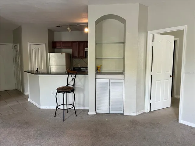 a view of a yard with a trampoline