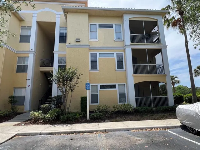 a view of a lake with a table and chairs